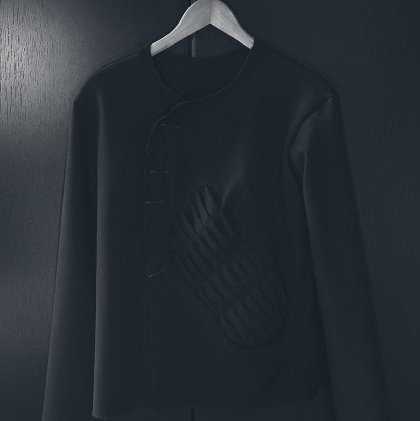 Jacket, prompted the feeling — quilt softened, pins and raw edges gone