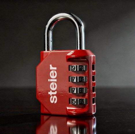 The padlock with the five variables set — hard key, shadow to near-black, wordmark intact